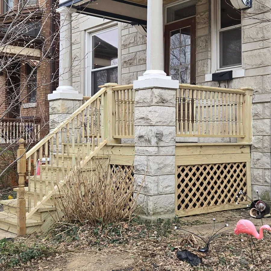 Historic stone rowhouse porch with turned-spindle railings